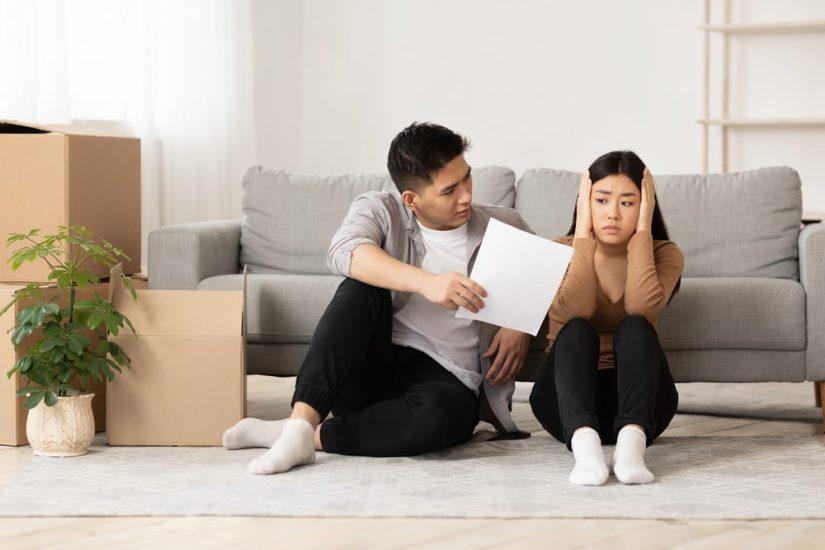 Man Showing A Piece Of Paper To His Girlfriend