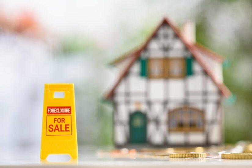 Foreclosure Sign Next To A House