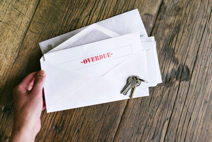 An Envelope With Overdue Written On It